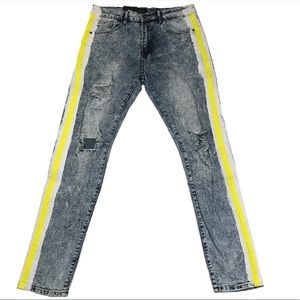 Men’s yellow and paint striped jeans.
